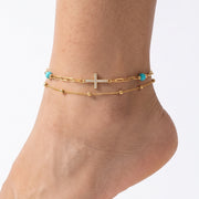 Close-up of the Lelice Faith Gold Anklet on a woman's ankle