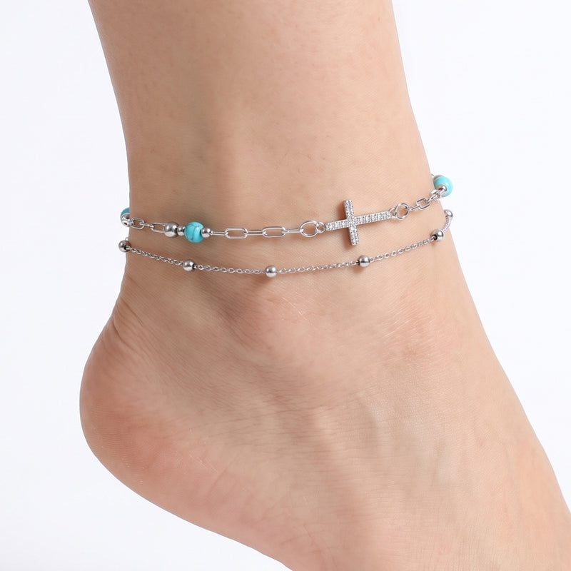 Close-up of the Lelice Faith Silver Anklet on a woman's ankle
