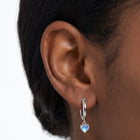 Close-up of the Lelice Florence Silver Hoops in silver on the ear