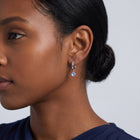 Model wearing the Lelice Florence Silver Hoops in silver, ear and jaw, slightly wider