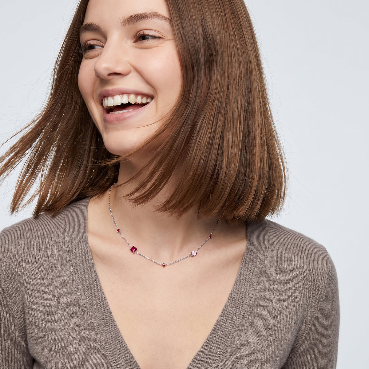 Laughing woman wearing the Geneva Zircon Necklace