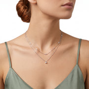 Woman wearing Lelice silver layered crystal station necklace Grace