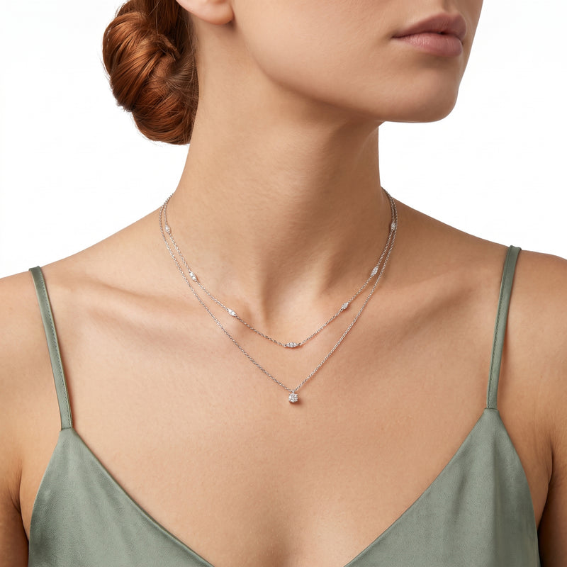 Woman wearing Lelice silver layered crystal station necklace Grace