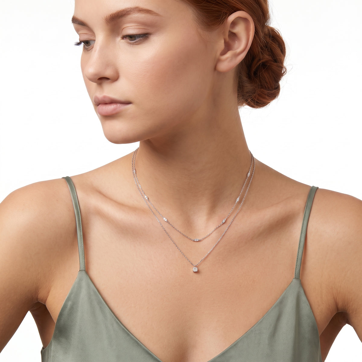 Profile of woman with hair up wearing Grace silver layered necklace