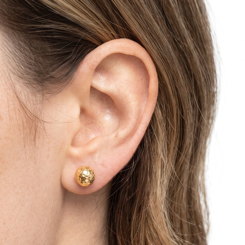 Close-up of the Lelice Hammered Gold Studs on the ear