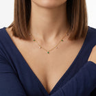 Close-up of the Lelice Havana Beaded Necklace in gold at the collarbone