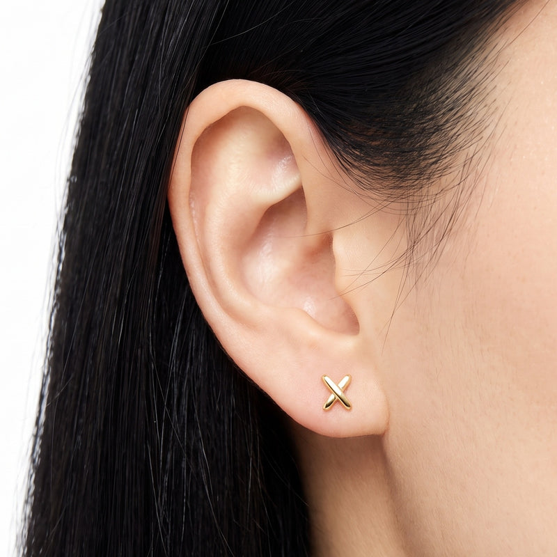 Close-up of the Lelice Holly Stud Earrings in gold on the ear