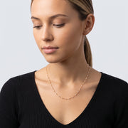 Woman looking down at the Ibiza Beaded Choker