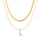 Lelice Initial Herringbone Necklace in gold on a white background