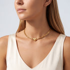 Woman in soft side light wearing the Juliet Heart Choker