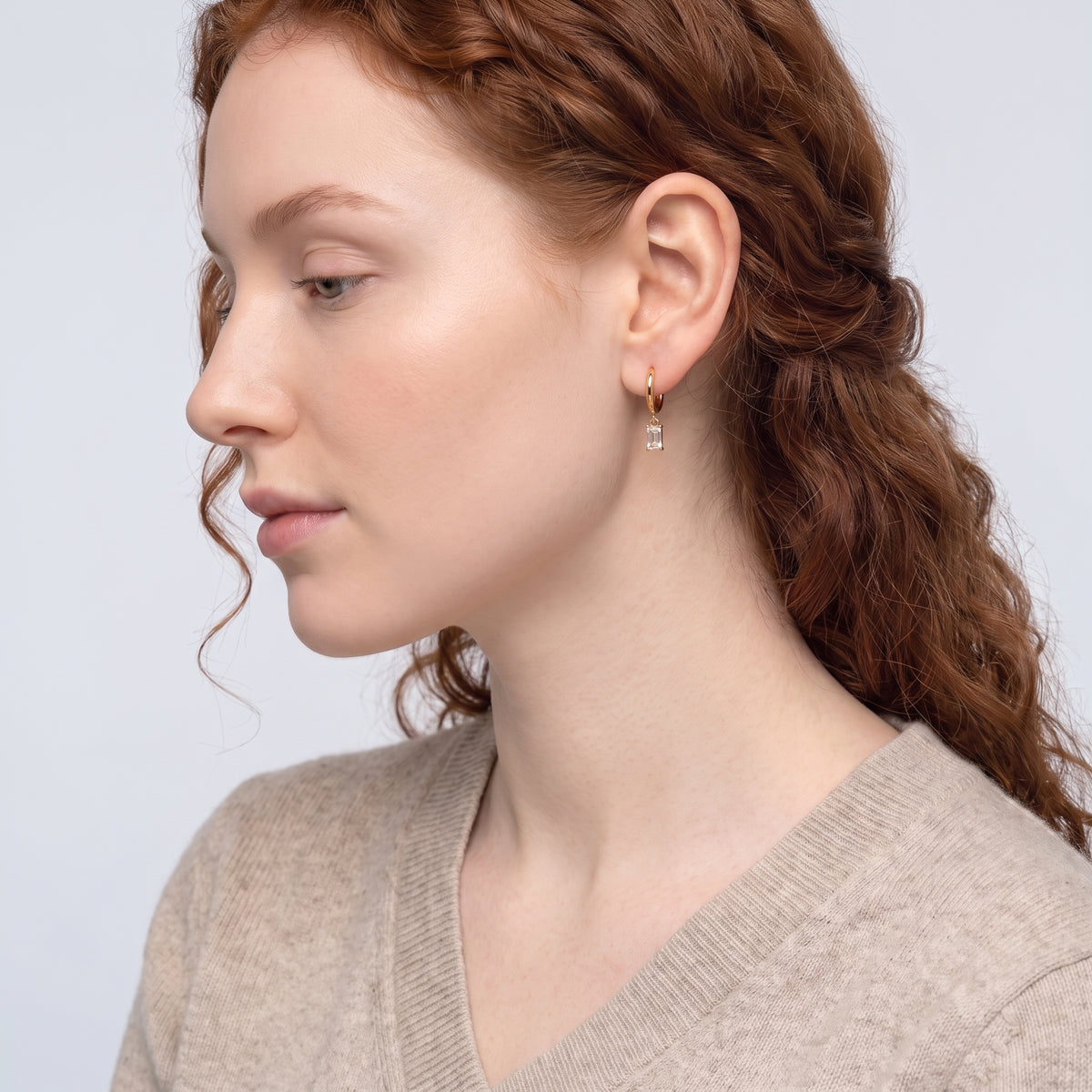 Model wearing the Lelice Justine Crystal Drops in gold, sculpted side profile