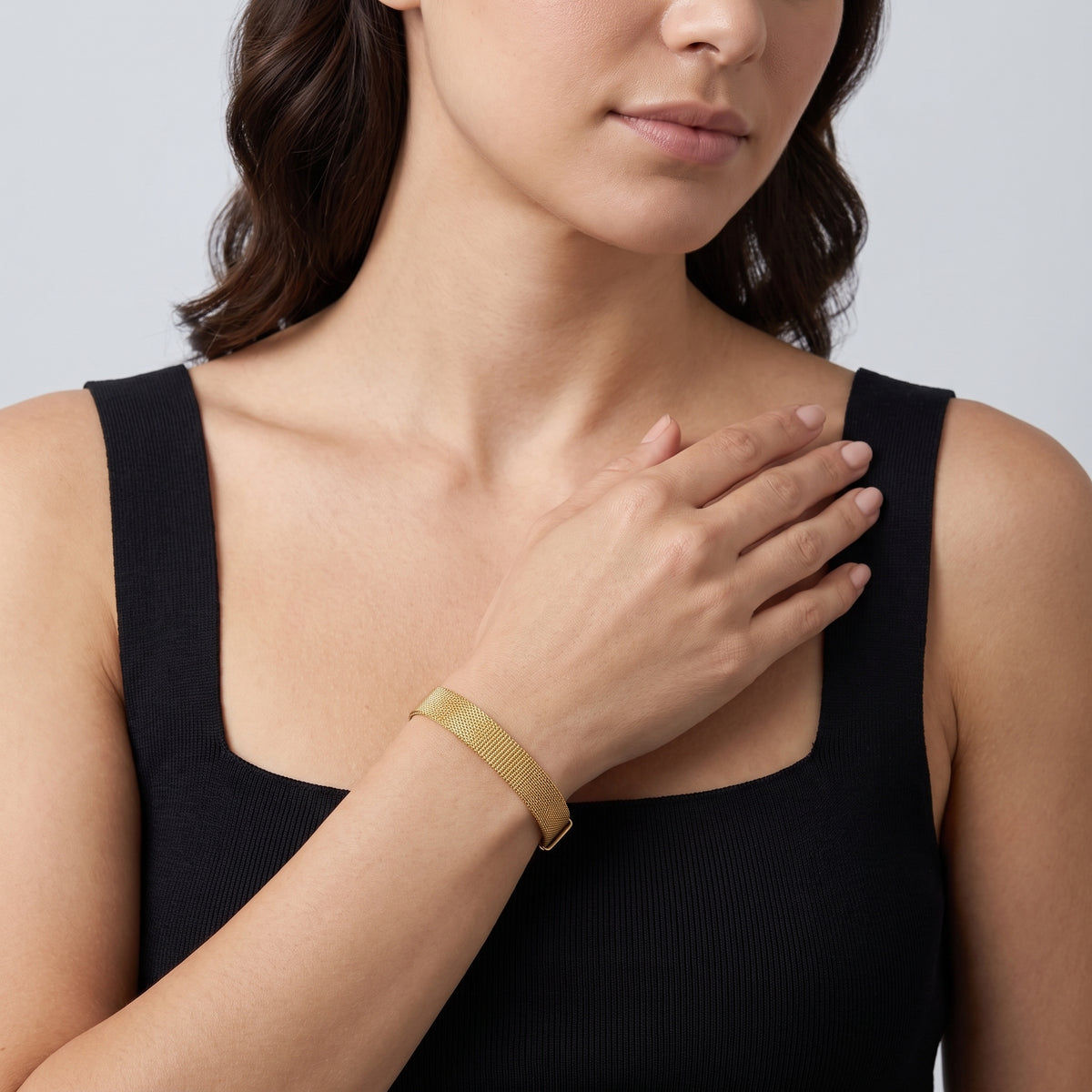 Model wearing the Lelice Celeste Sleek Bracelet in gold, hand across the chest
