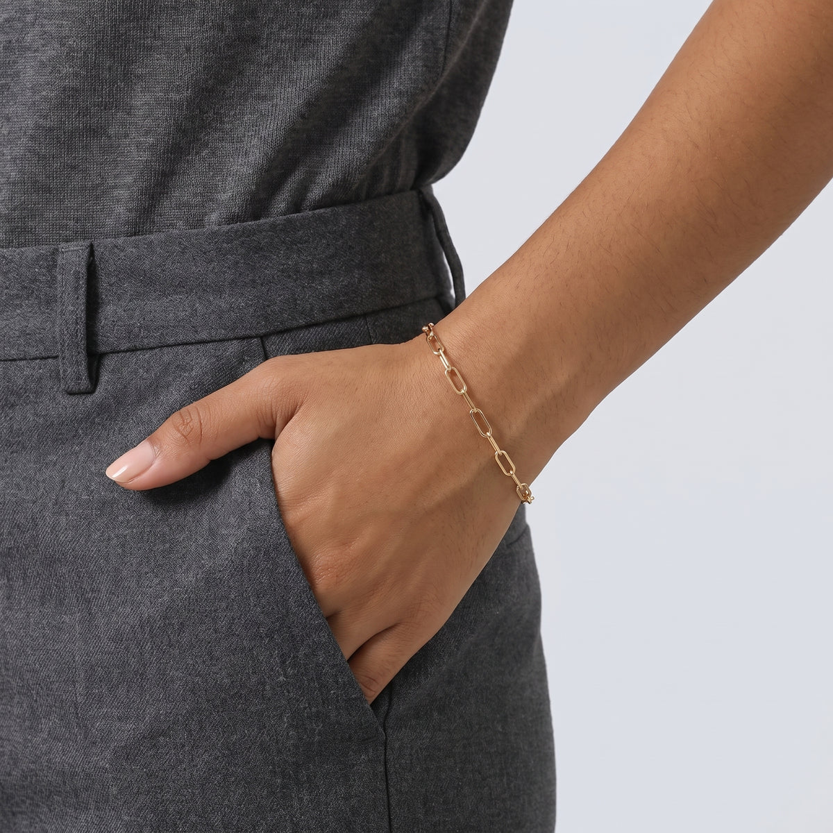 Model wearing the Lelice Classic Paperclip Chain in gold, hand in the trouser pocket