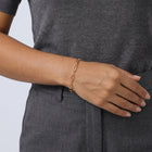 Model wearing the Lelice Classic Paperclip Chain in gold, hand resting at the waist