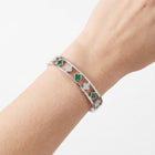 Close-up of the Lelice Dublin Quatrefoil Silver Bangle on the wrist