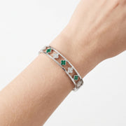 Close-up of the Lelice Dublin Quatrefoil Silver Bangle on the wrist