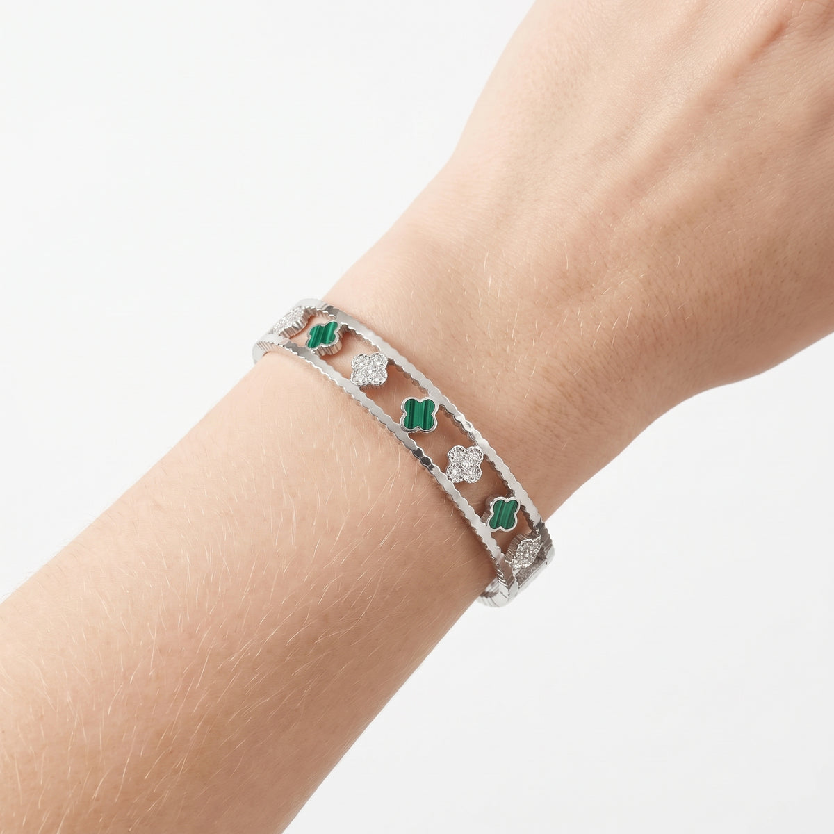 Close-up of the Lelice Dublin Quatrefoil Silver Bangle on the wrist