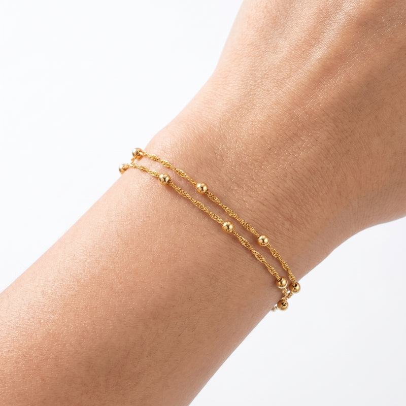 Close-up of the Lelice Lola Double Bracelet in gold on the wrist