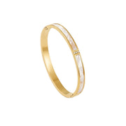 Lelice Lyra Cuff Bangle in gold on a white background