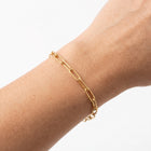Close-up of the Lelice Margot Gold Paperclip Chain Link Bracelet on the wrist