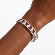 Close-up of the Lelice Miya Silver Clover Bangle on the wrist