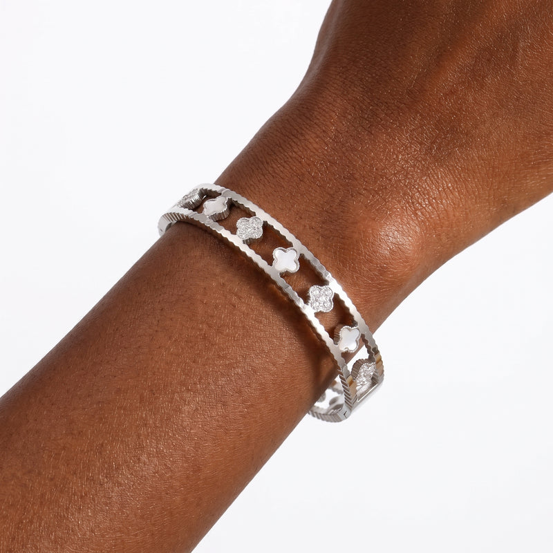 Close-up of the Lelice Miya Silver Clover Bangle on the wrist