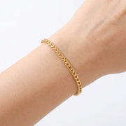 Close-up of the Lelice Monaco Spiga Bracelet in gold on the wrist