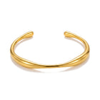 Lelice Sahara Wave Bangle in gold on a white background