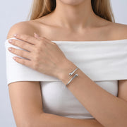 Model wearing the Lelice Sloane Silver Cuff, hand on the opposite shoulder
