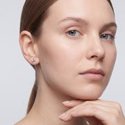 Model wearing the Lelice Léonie Silver Studs, hand at the chin