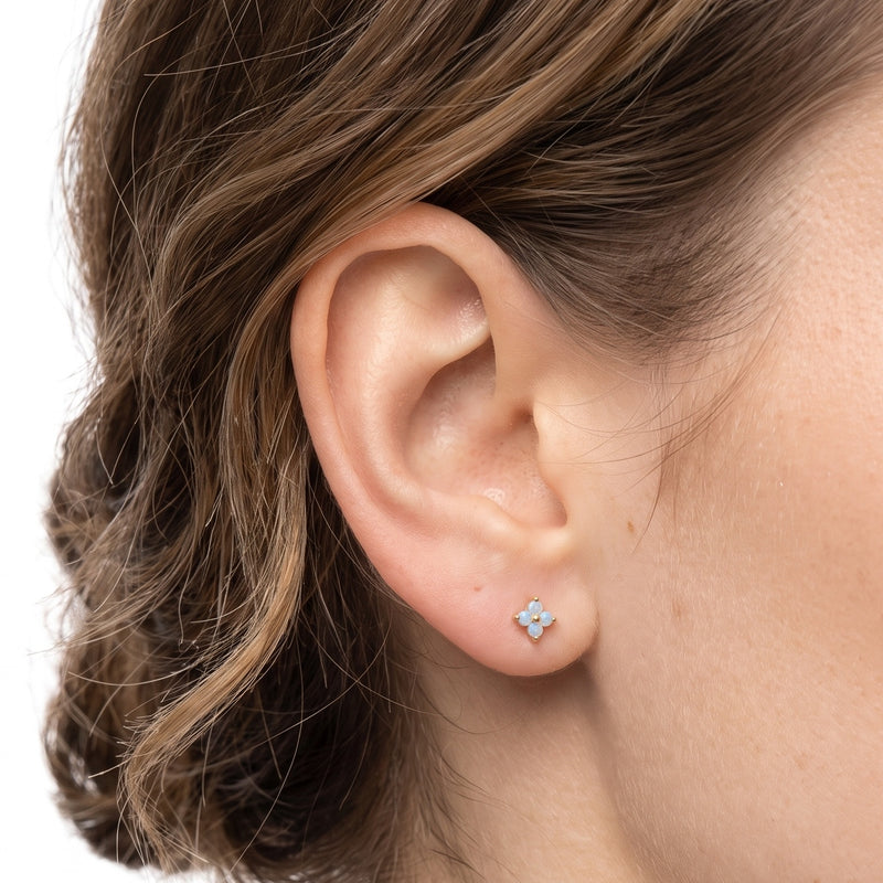 Close-up of the Lelice Lily Crystal Studs in gold on the ear