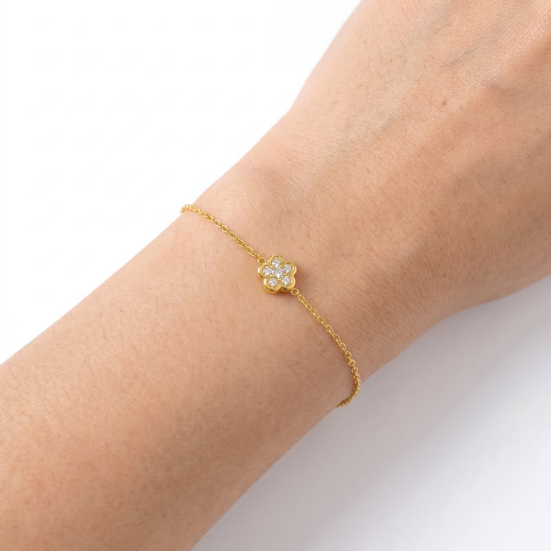 Close-up of the Lelice Lise Clover Bracelet in gold on the wrist