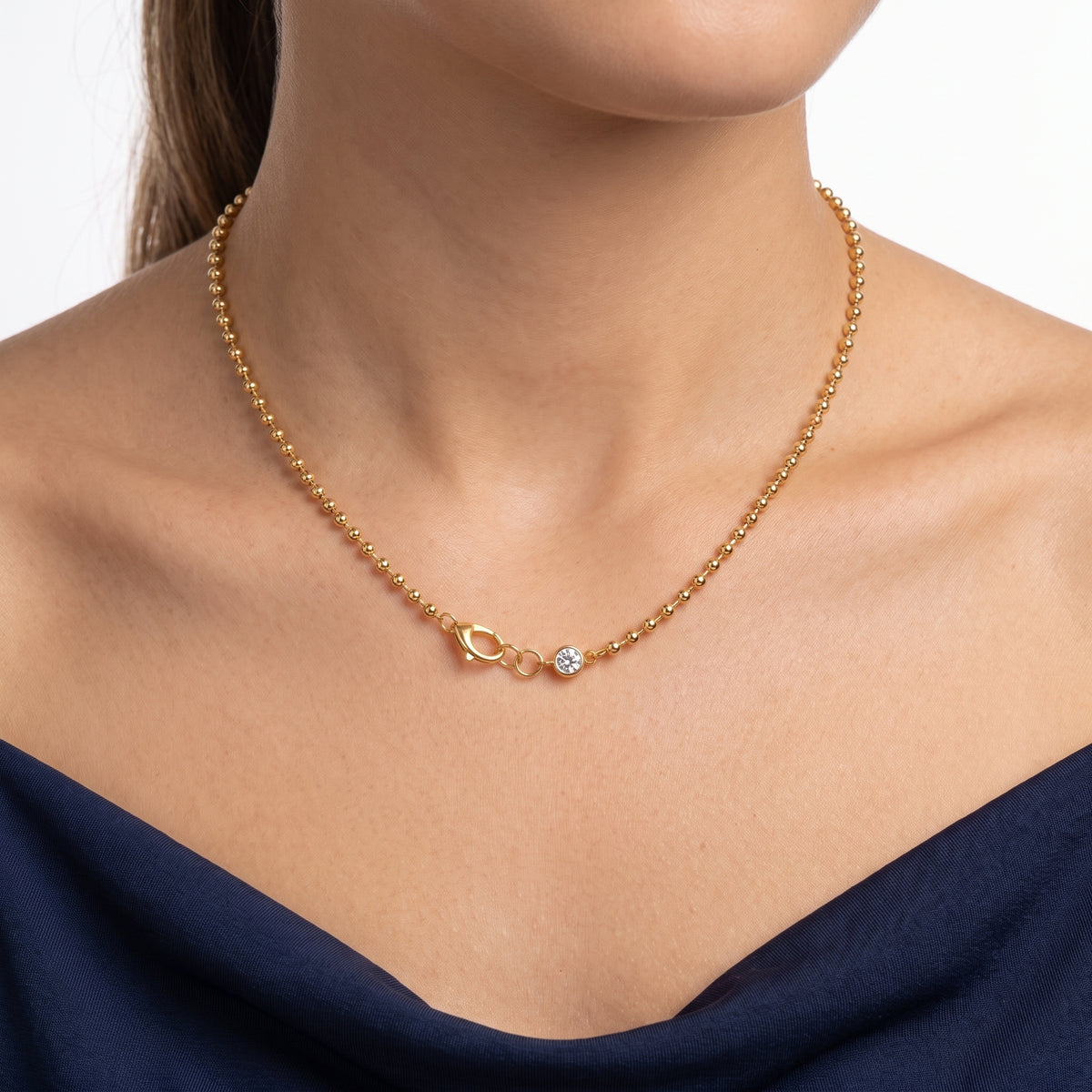 Close-up of the Lelice Maeve Classic Necklace in gold at the collarbone