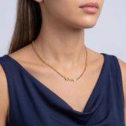 Woman turned three-quarters wearing the Maeve Classic Necklace