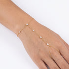 Close-up of the Lelice Margaux Sparkle Bracelet in gold on the wrist and hand