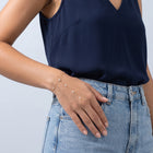 Model wearing the Lelice Margaux Sparkle Bracelet in gold, hand in the jeans pocket