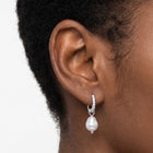 Close-up of the Lelice Margo Silver Huggies on the ear