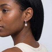 Model wearing the Lelice Margo Silver Huggies, ear and jaw, slightly wider