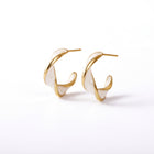 Lelice Margot Twist Hoops in gold on a white background