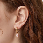 Close-up of the Lelice Marie Pearl Earrings in gold on the ear