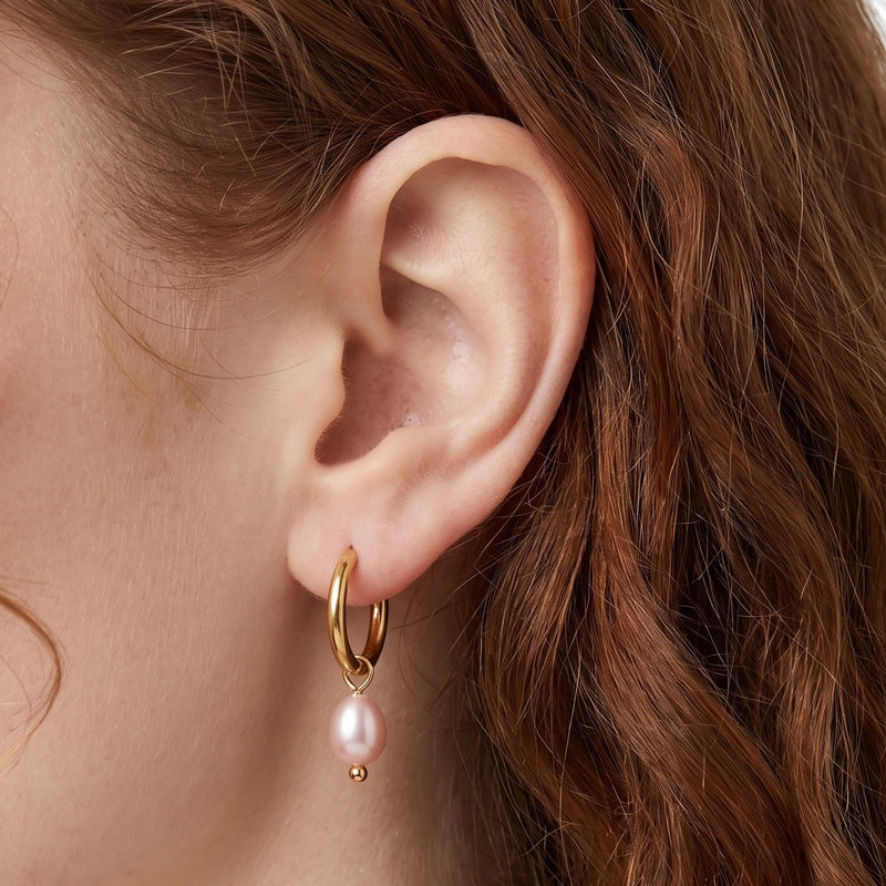Close-up of the Lelice Marie Pearl Earrings in gold on the ear