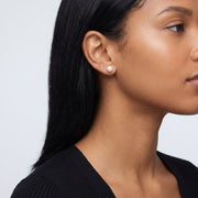 Model wearing the Lelice Matilda Pearl Earrings in silver, ear and jaw, slightly wider