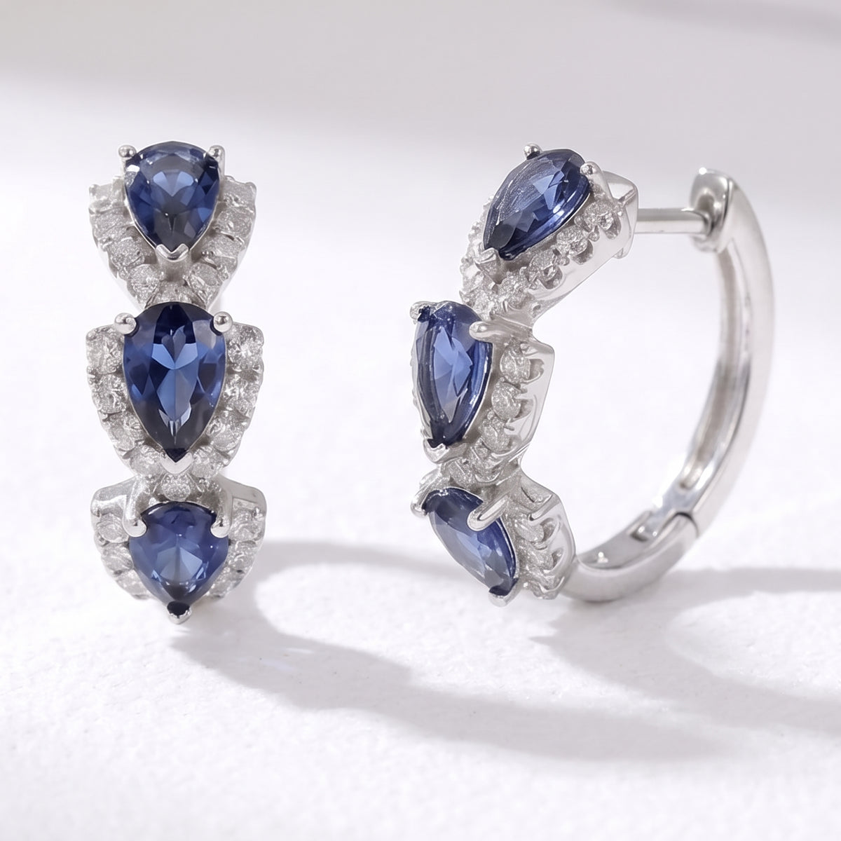 Lelice Midnight Sapphire Hoops in silver on a white background