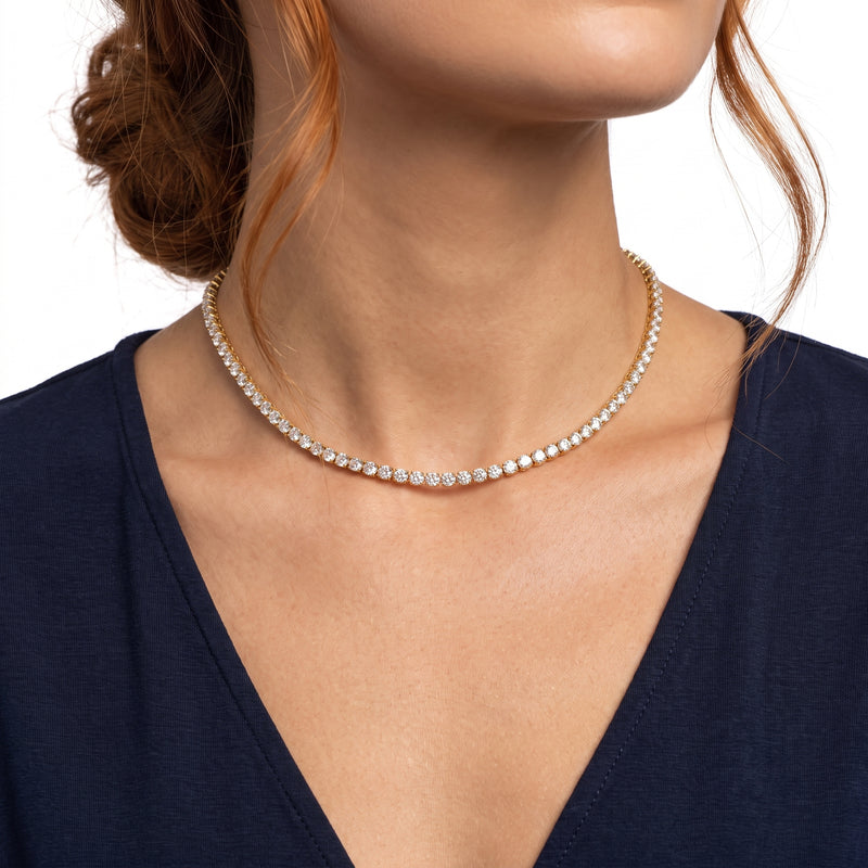 Close-up of the Lelice Monaco Tennis Choker in gold at the collarbone