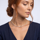 Neckline profile with hair up, wearing the Monaco Tennis Choker
