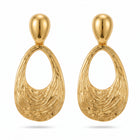Lelice Nadia Gold Textured Teardrop Statement Earrings on a white background