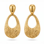 Lelice Nadia Gold Textured Teardrop Statement Earrings on a white background