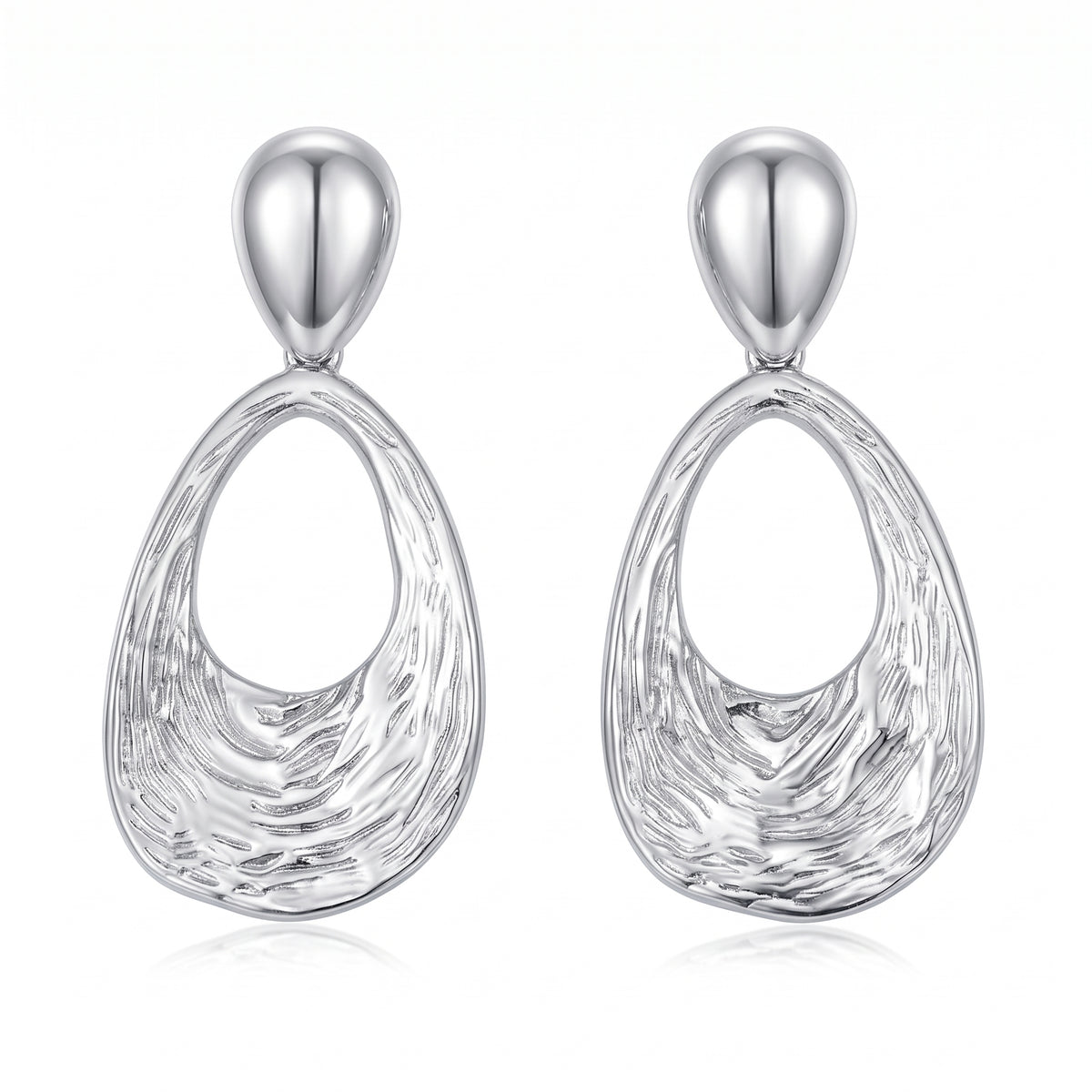 Lelice Nadia Silver Textured Teardrop Statement Earrings on a white background