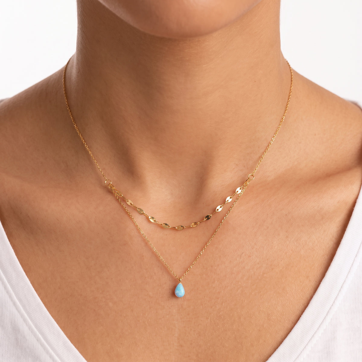 Close-up of the Lelice Naxos Opal Necklace in gold at the collarbone