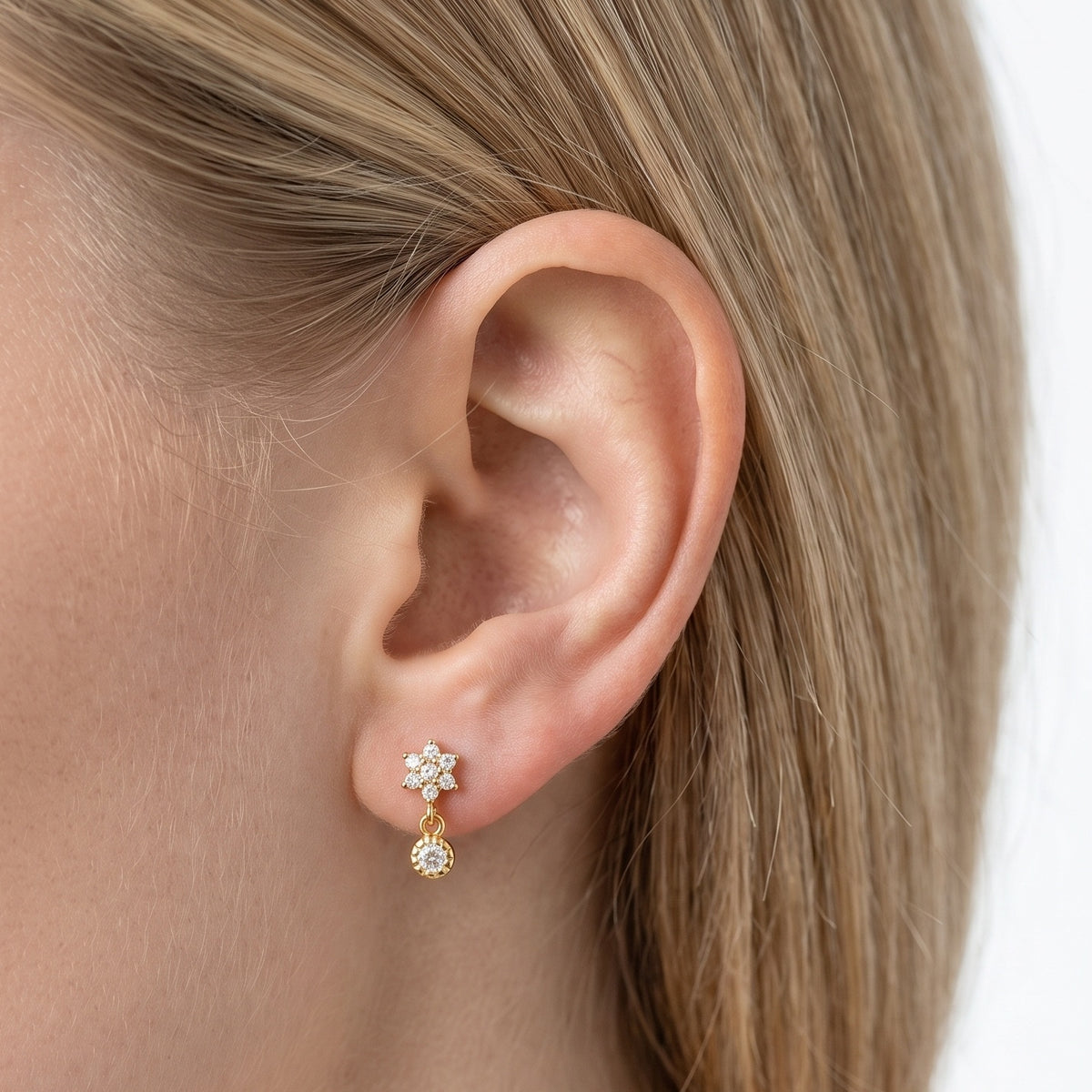 Close-up of the Lelice Nina Petite Studs in gold on the ear
